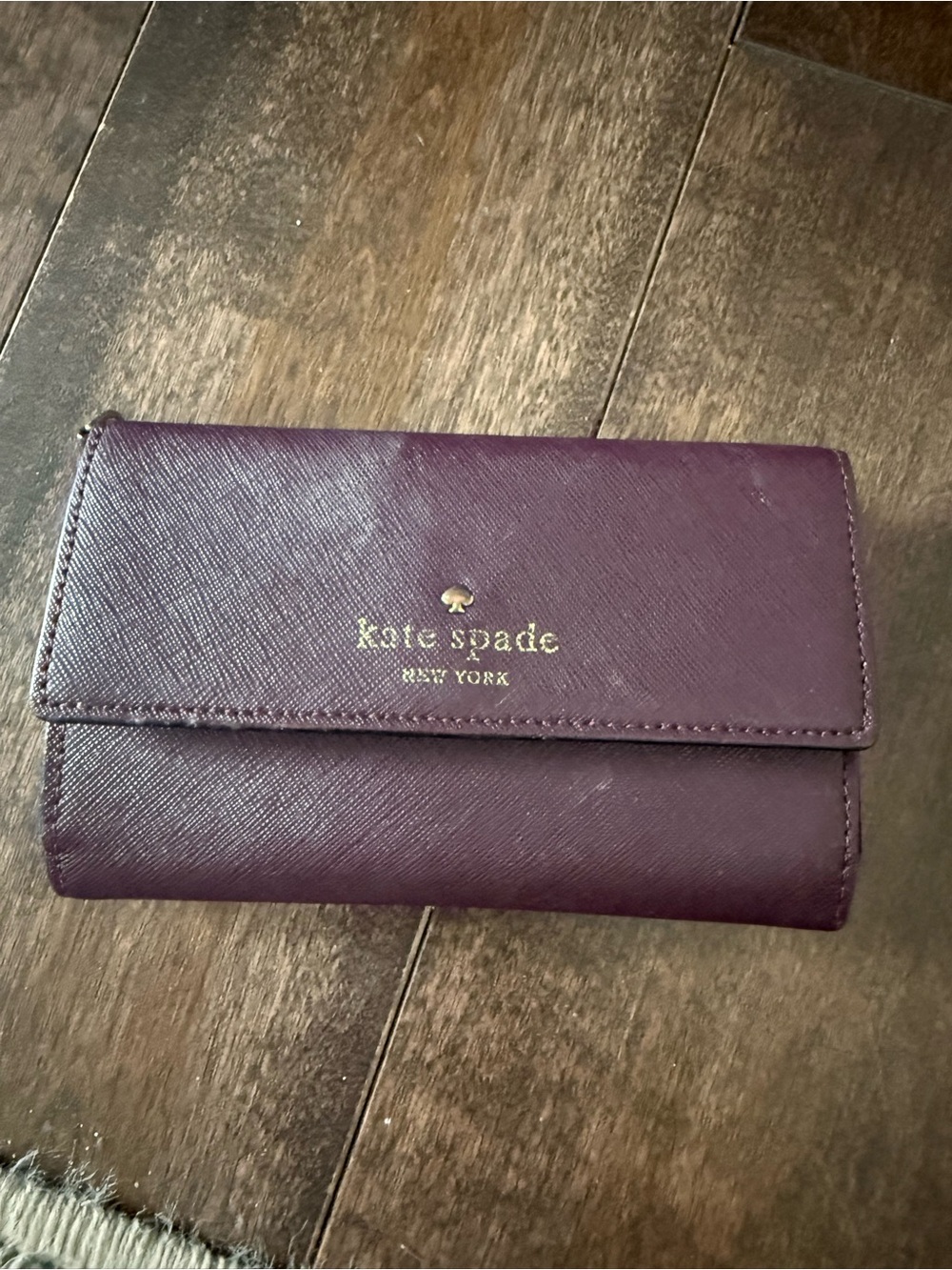kate spade plum leather bi-fold wallet with gold logo